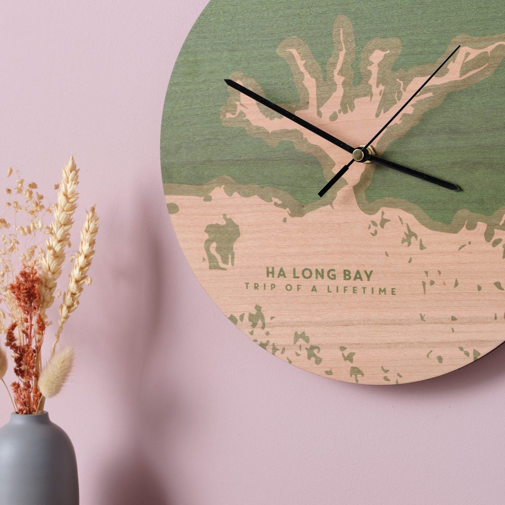 close up wooden painted coastline clock green